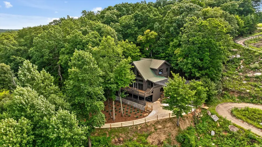 Aerial of the winding driveway through the forest