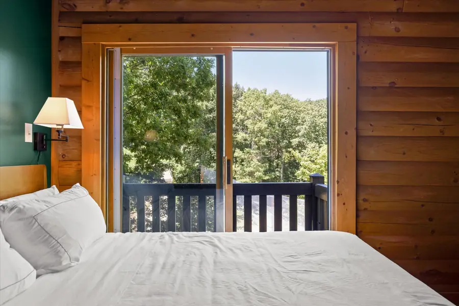 King bedroom with sliding doors onto a private deck