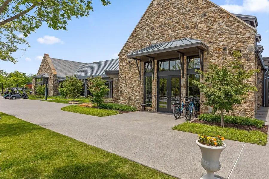 Stone clubhouse building with glass gables at McLemore