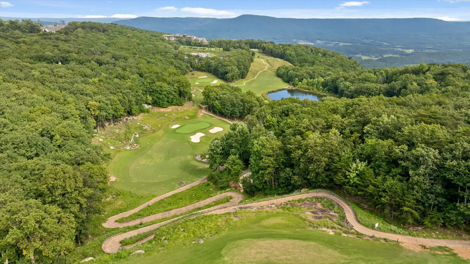 Aerial view of the McLemore golf course spread along the mountaintop with the valley beyond