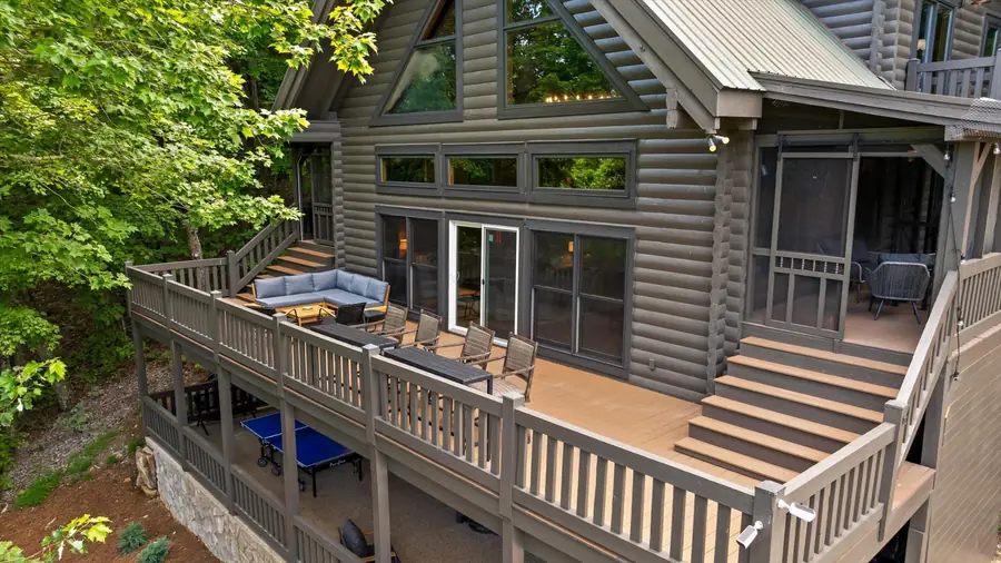 Covered deck with lounge seating and outdoor television