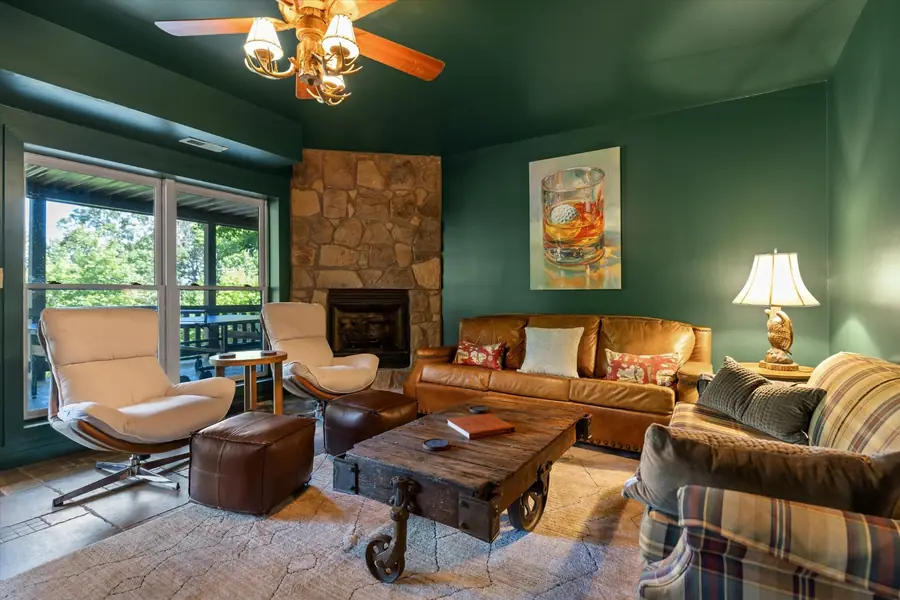 Wide view of the lower level den with seating for eight