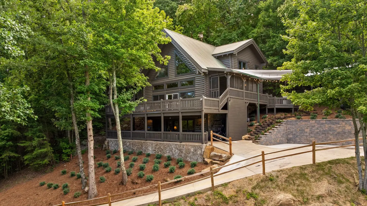 The front elevation of The Eyrie House, three levels of cedar and stone under a steep gabled roof
