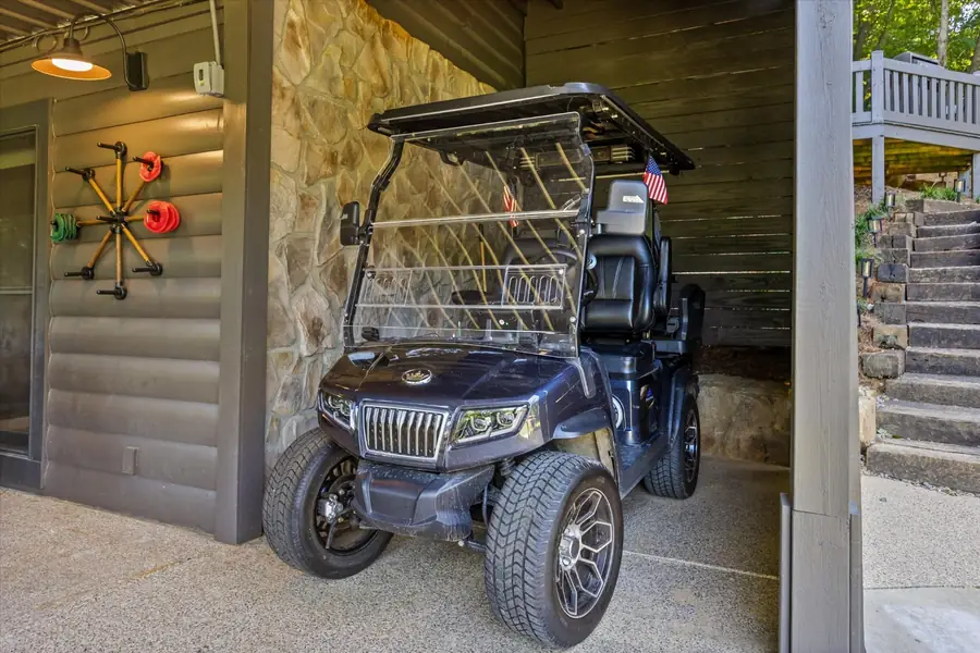 Golf cart parked in the covered lower bay