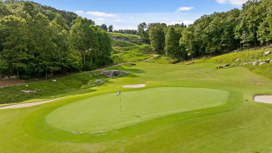 Close view of a manicured green with a flagstick