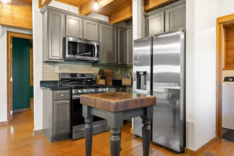 Gas range and stainless steel refrigerator