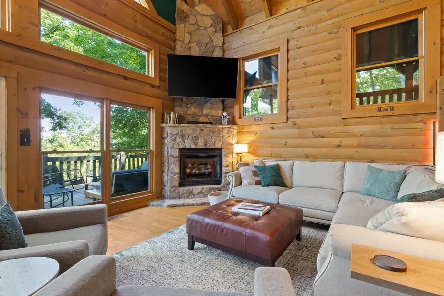 Large sectional sofa and leather ottoman in the living area